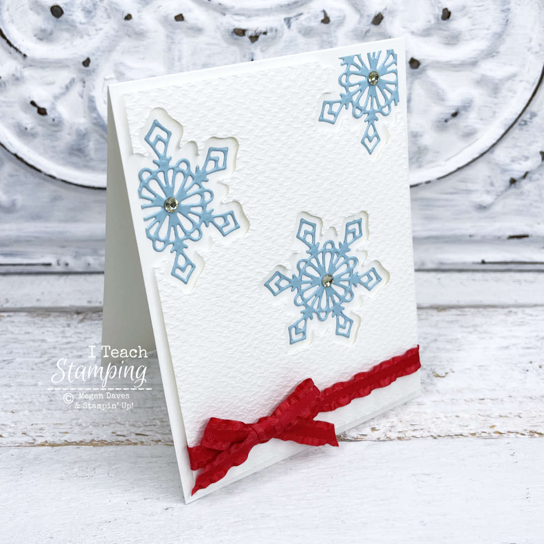 Today's handmade Christmas card uses a snowflake die cut for the window and decorative details