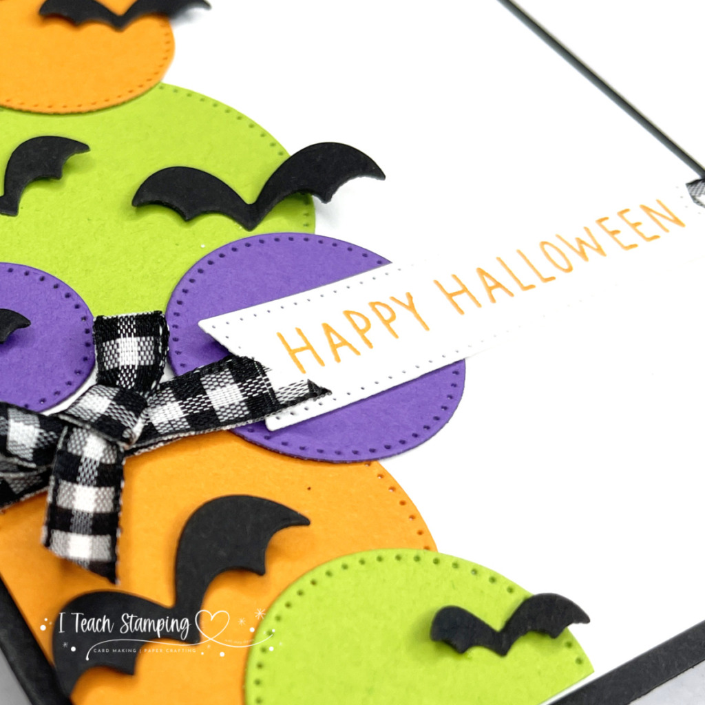 Simple die cut circles in bright Halloween colors, black die cut bats and a greeting come together to make a Halloween card in mere minutes!